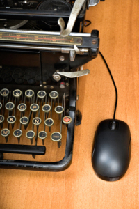 typewriter with compter mouse attached